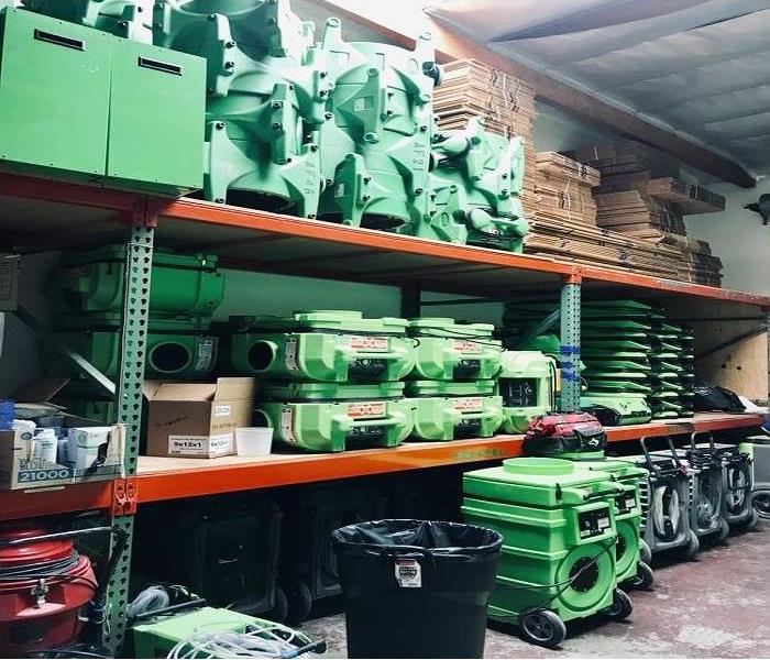 Variety of airmovers, dehus and desicants stacked in the warehouse of 3 levels. 